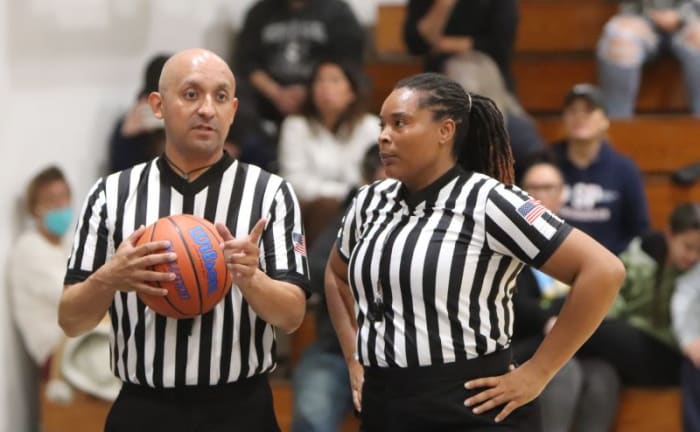 Officials Matt Zamora of Whittier and Tisha McAfee of Compton confer.